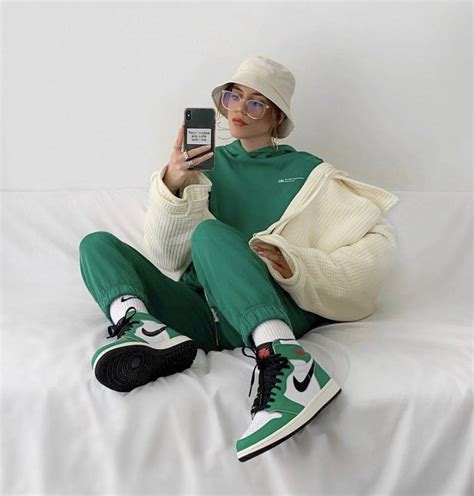 Opt for a classic black or olive <b>green</b> pair of cargo pants to maintain a sleek and versatile look. . Green and white jordan 1 outfit ideas